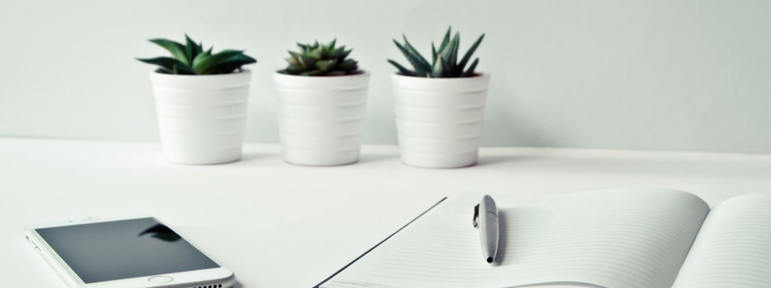 Pen and notebook on desk